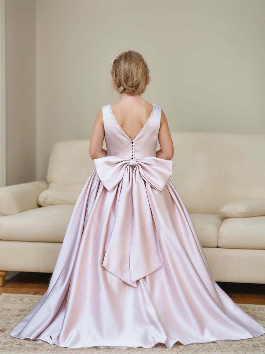 Satin dress with beaded neckline and bow detail in pink sleeveless