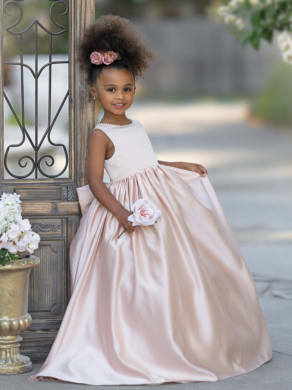 Satin dress with beaded neckline and bow detail in pink sleeveless