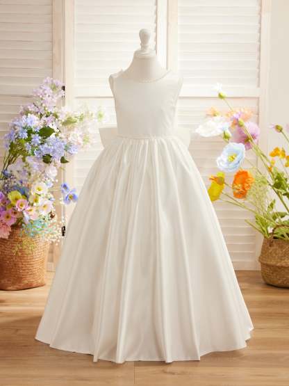 Satin dress with beaded neckline and bow detail in pink sleeveless