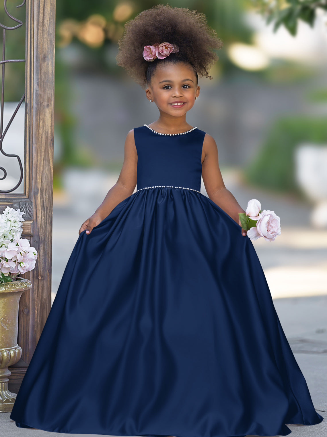 Satin dress with beaded neckline and bow detail in pink sleeveless