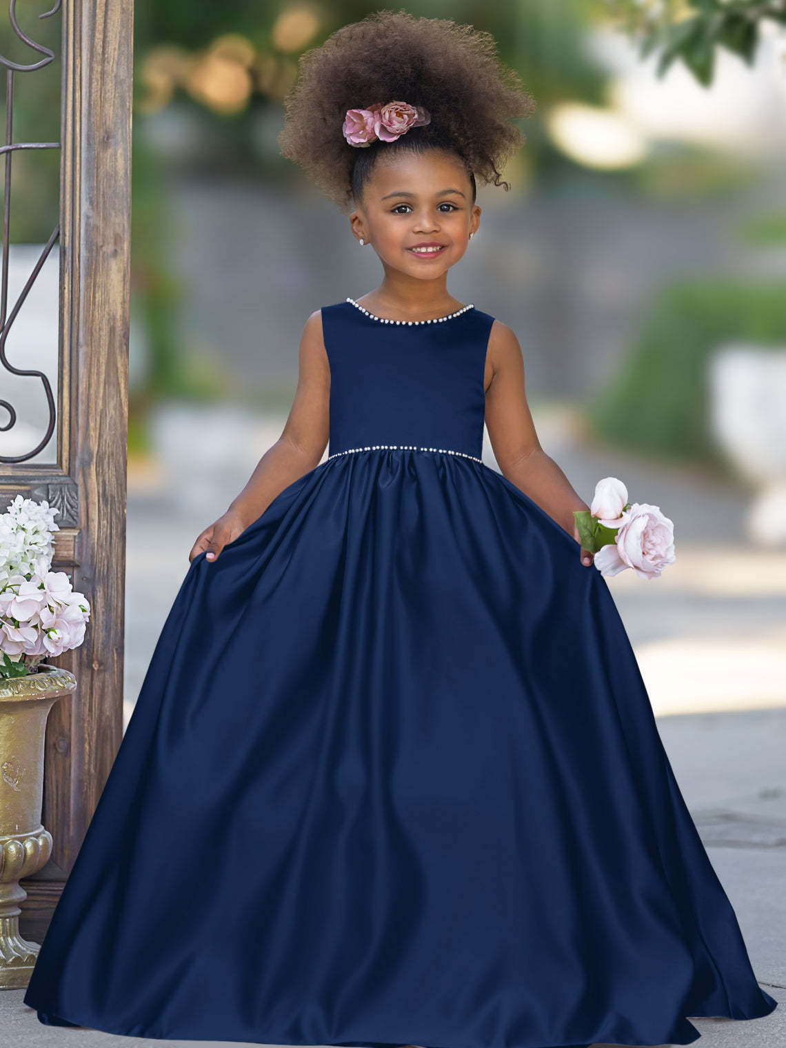 Satin dress with beaded neckline and bow detail in pink sleeveless