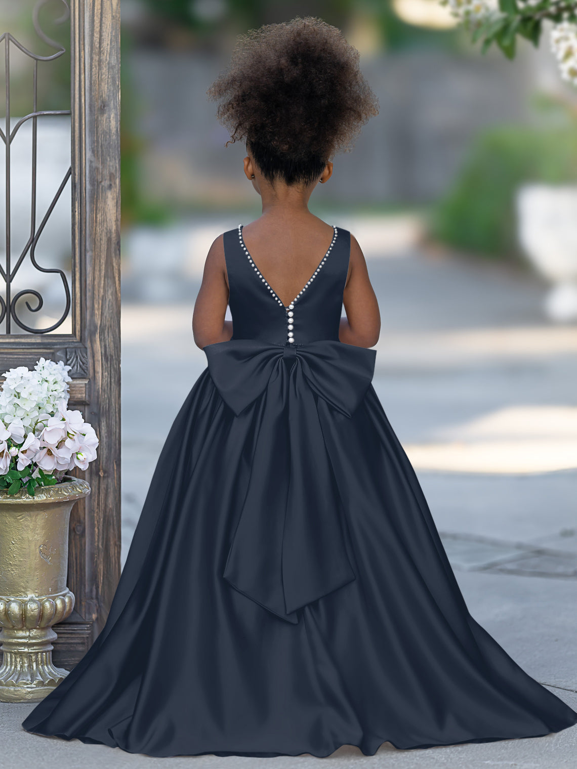 Satin dress with beaded neckline and bow detail in pink sleeveless