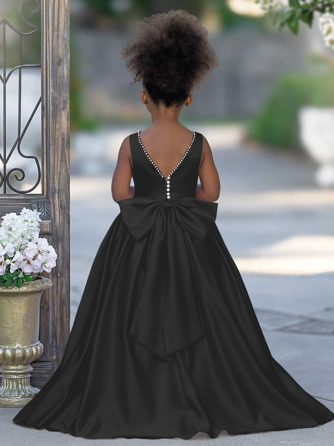 Satin dress with beaded neckline and bow detail in pink sleeveless