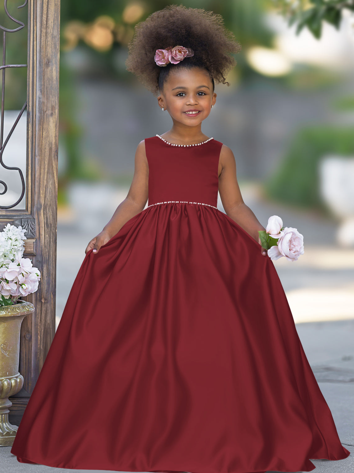 Satin dress with beaded neckline and bow detail in pink sleeveless