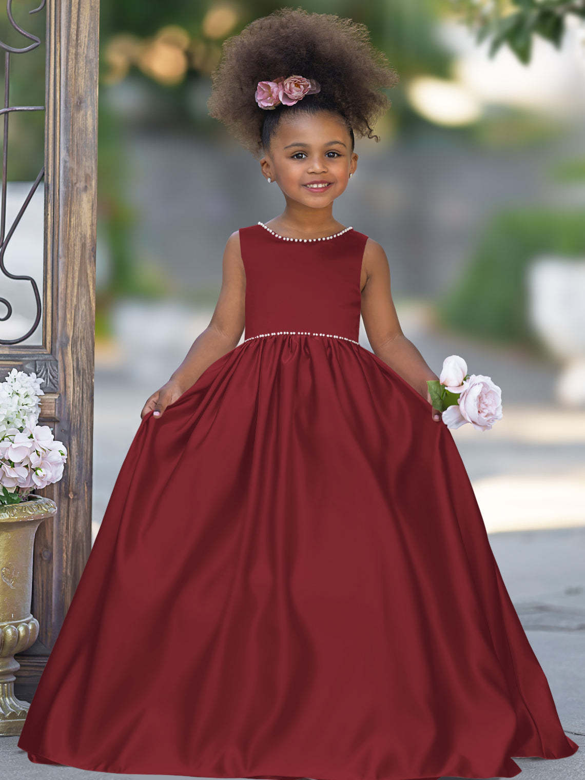 Satin dress with beaded neckline and bow detail in pink sleeveless