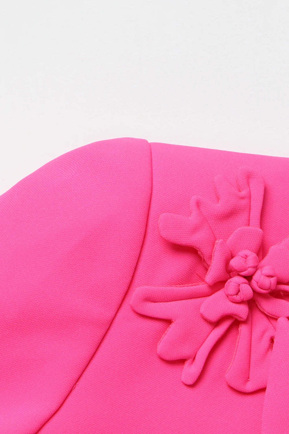 Fuchsia double-breasted blazer for women featuring peak lapels and floral details