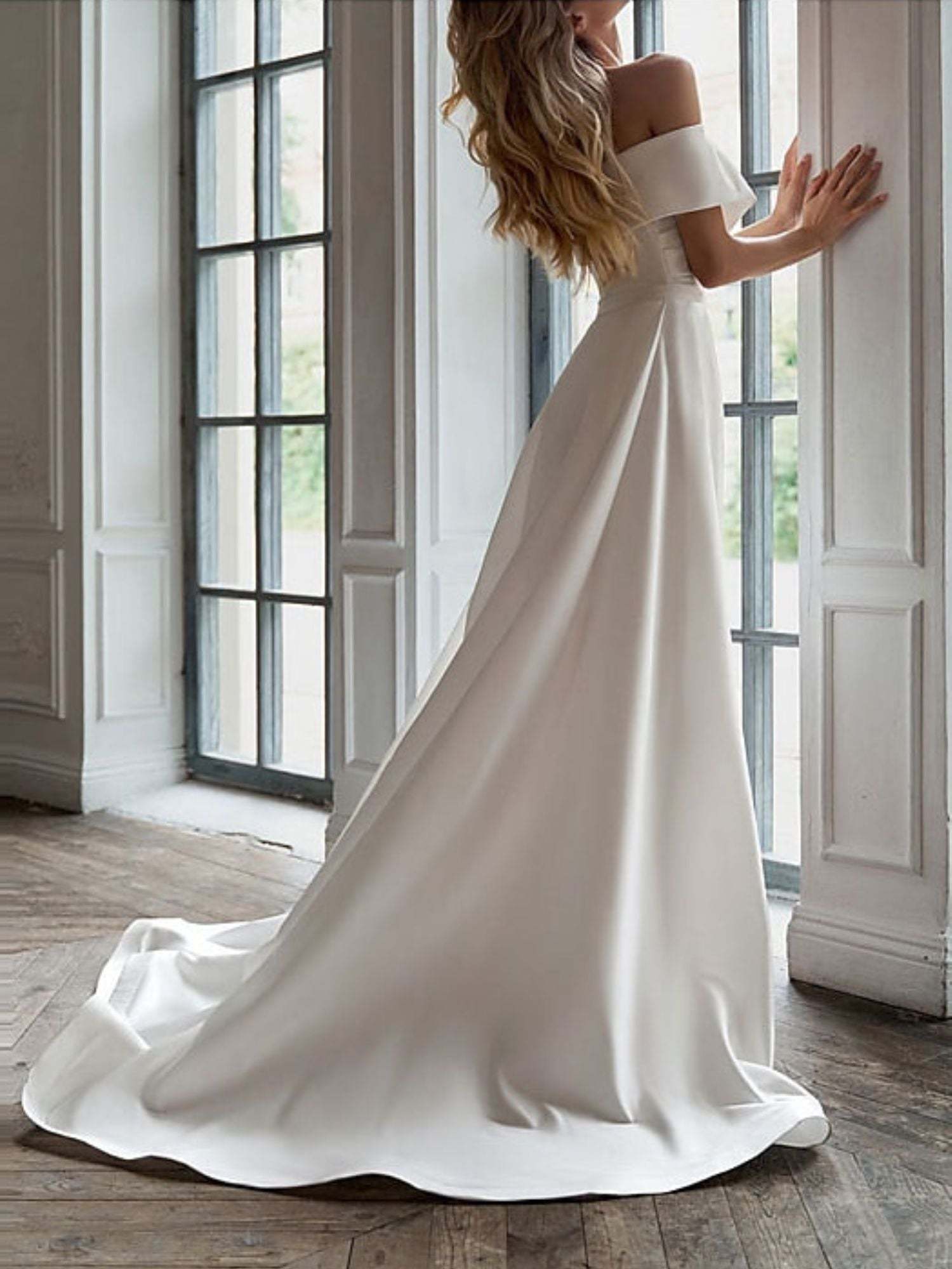 Elegant Off-the-Shoulder Wedding Dress with Short Sleeves and Ruffle Sheath