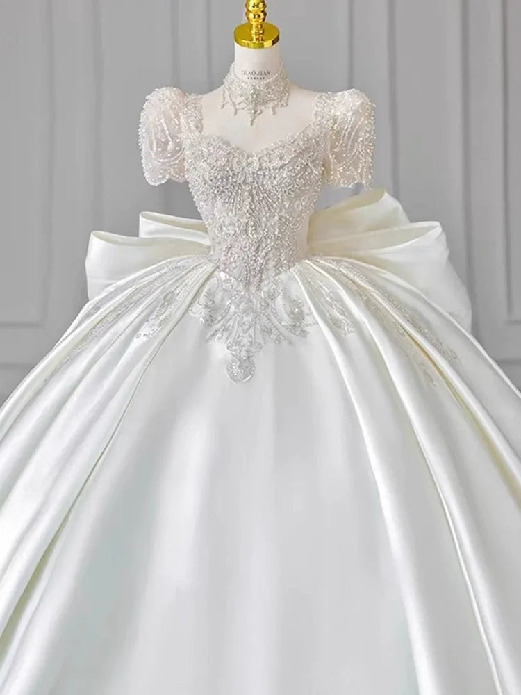 Sweetheart Short-Sleeve Ball Gown Wedding Dress with Lace Appliques, Beads & Oversized Bow