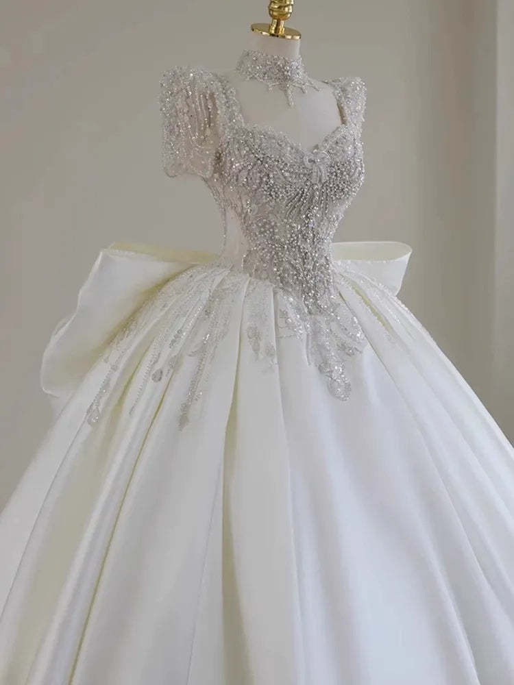 Sweetheart Short-Sleeve Ball Gown Wedding Dress with Lace Appliques, Beads & Oversized Bow