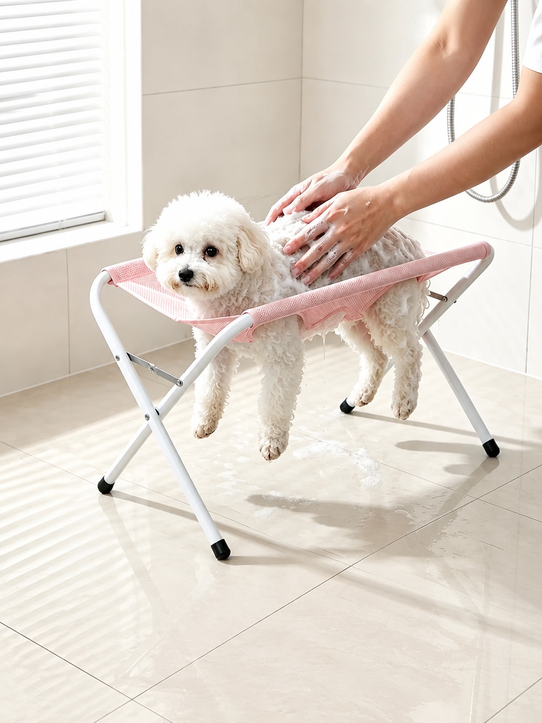 Pink pet bathing support stand shown during supervised dog washing