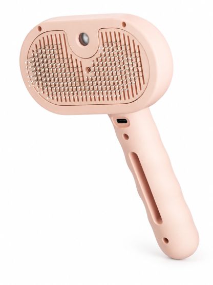 Pink MistGlide spray grooming brush with soft peach-pink housing