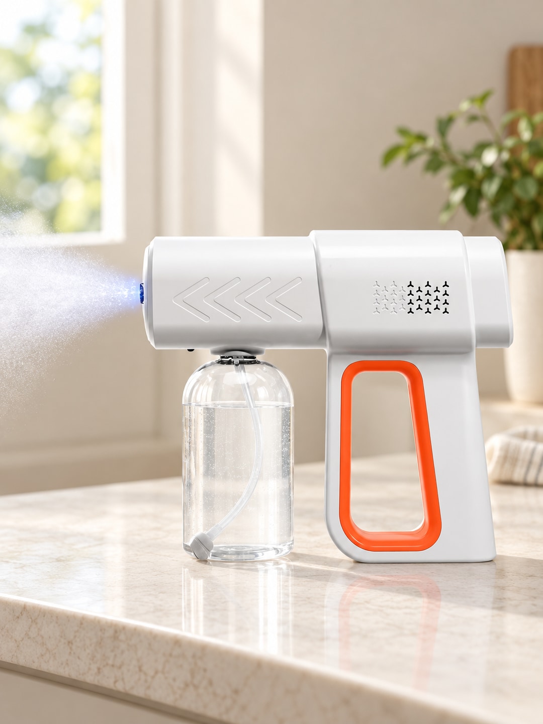 Side view of the K6PRO sprayer emitting a light mist on a household counter
