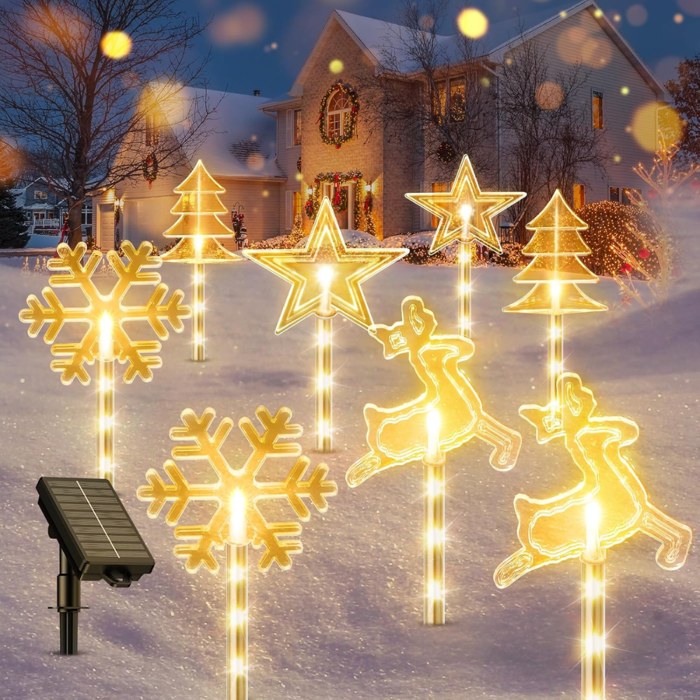Solar Christmas pathway stake lights in snowflake, star, reindeer, and tree shapes with warm white LEDs in snowy yard