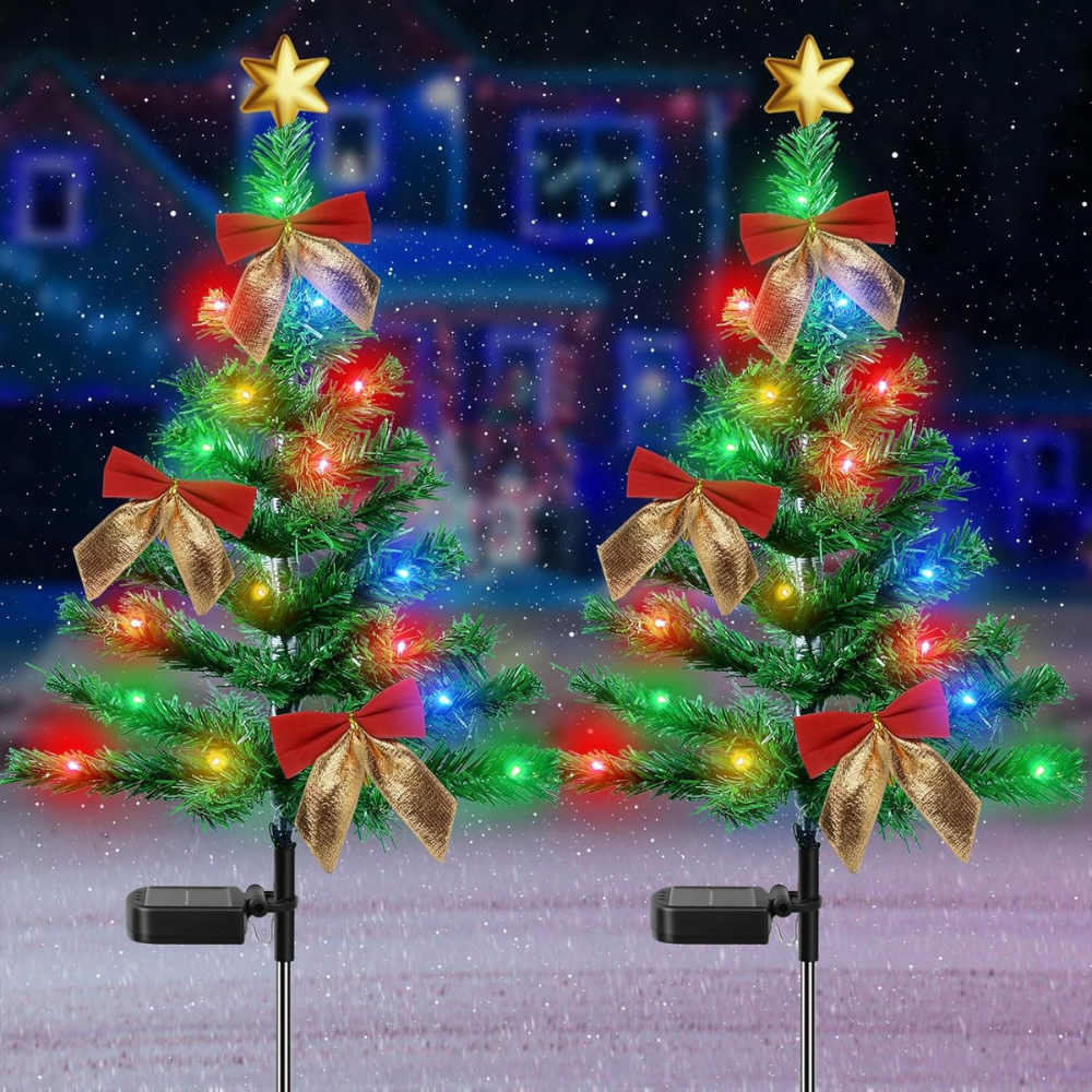 Two solar Christmas tree outdoor lights with gold star topper, red bows, and multicolor LEDs, product shot on plain background