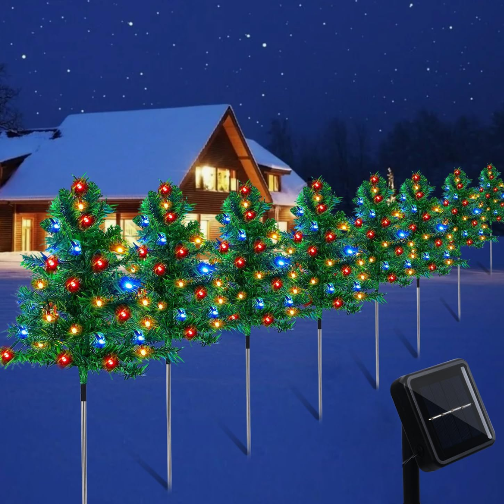 Eight solar Christmas tree pathway stake lights with multicolor C6 LED bulbs arranged in a row with a solar panel visible on one unit