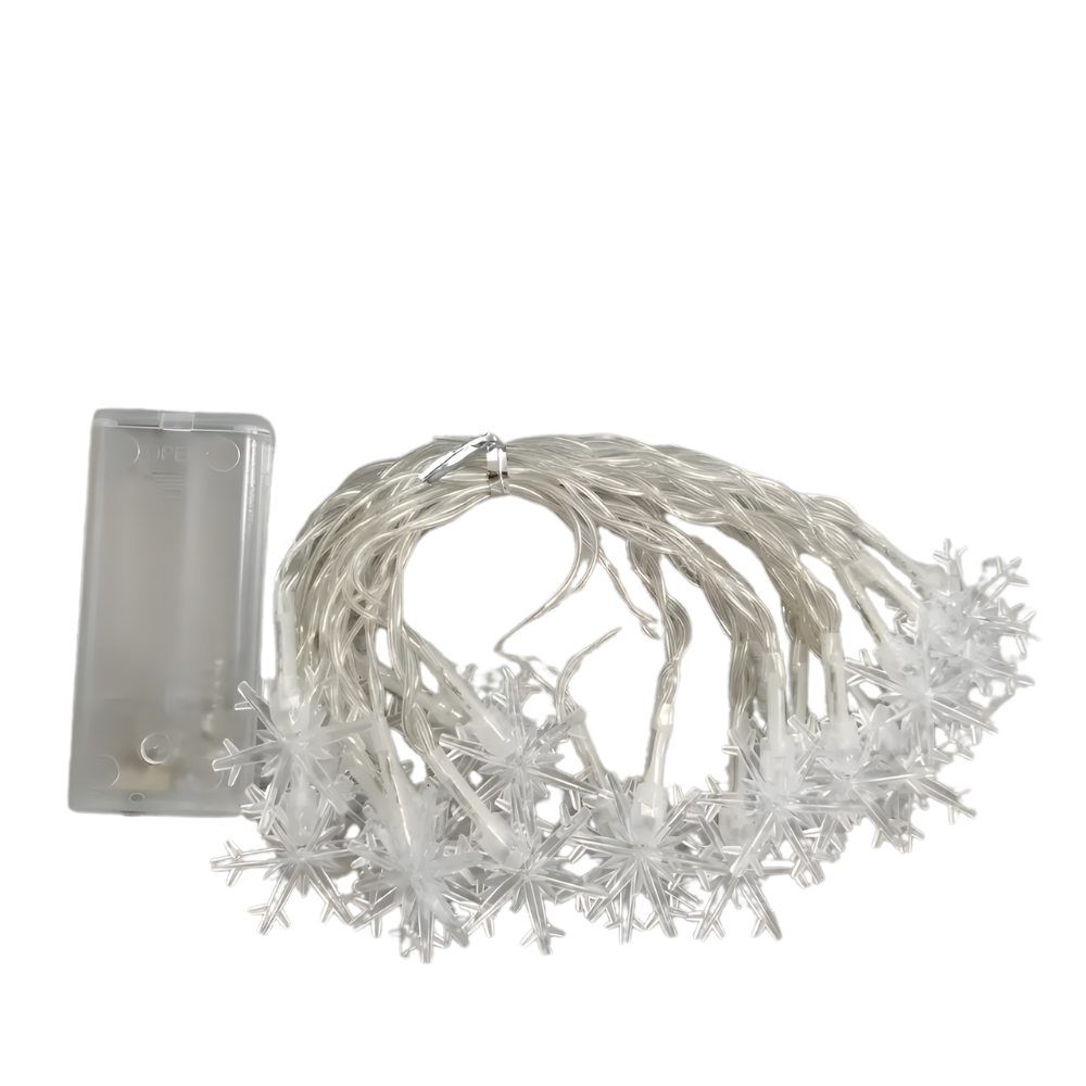 Battery powered LED snowflake string lights uncoiled on white background showing battery box and snowflake bulbs