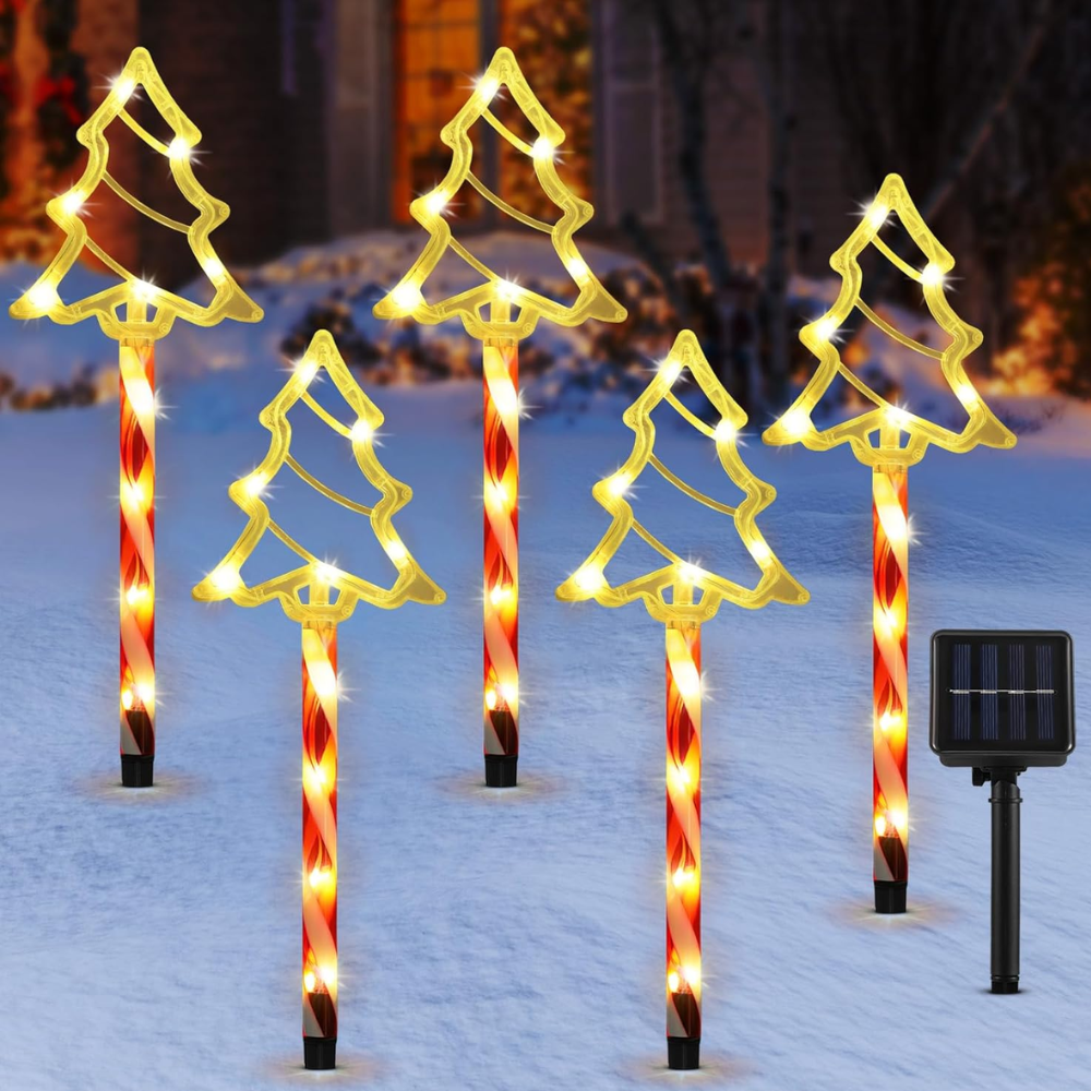 Five solar pathway lights with gold Christmas tree silhouette toppers on candy cane poles, white background product shot with solar panel
