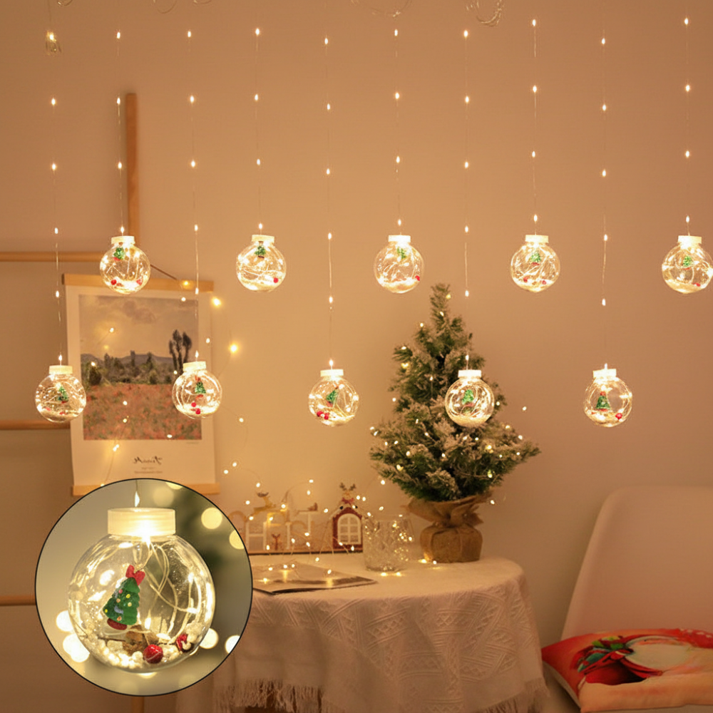 LED Christmas curtain lights with Christmas tree globe ornament figures glowing warm white on a wall