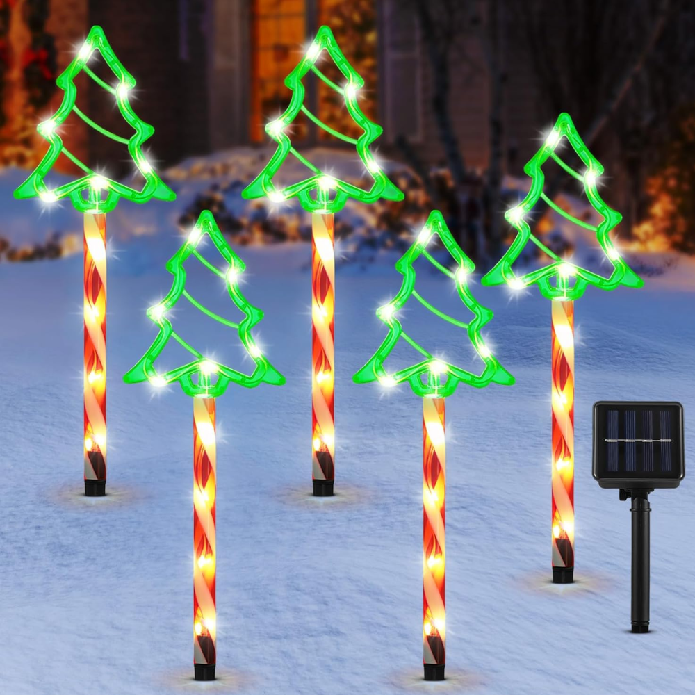 Five solar pathway lights with green Christmas tree outline toppers on candy cane poles, plain background product shot with solar panel