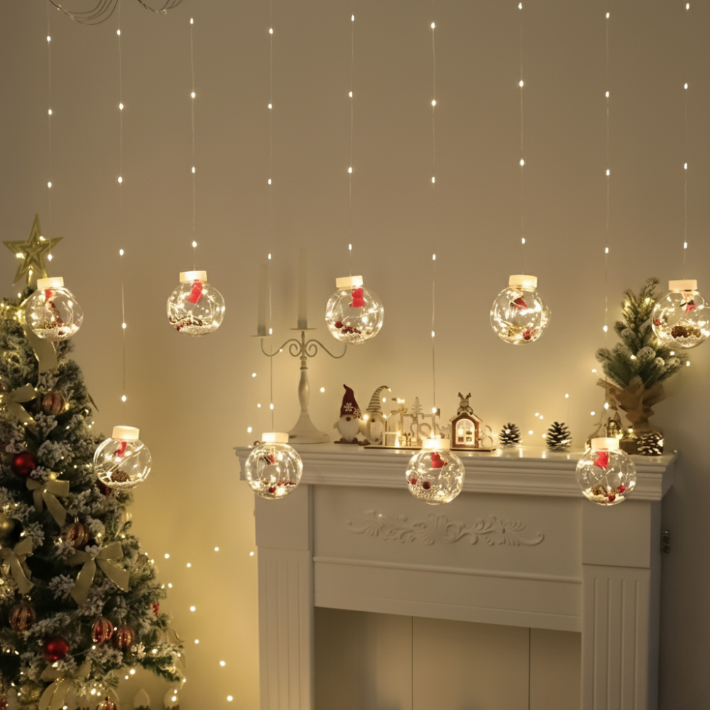 LED Christmas curtain lights with snowman and Santa globe figures glowing warm white above a fireplace mantel