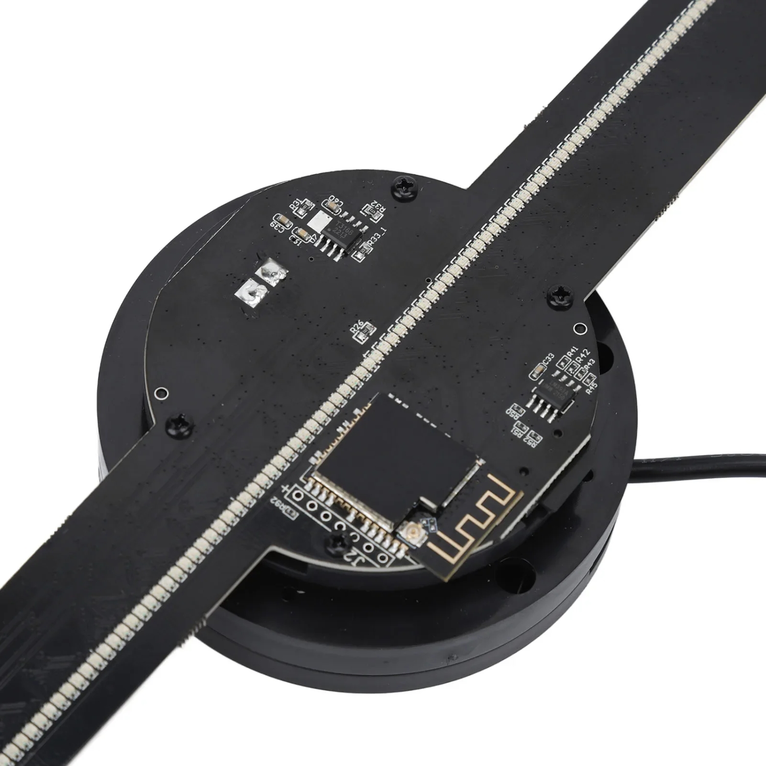 LED hologram fan unit viewed diagonally showing the two LED arm blades crossing through the circular hub at an angle, power cable attached