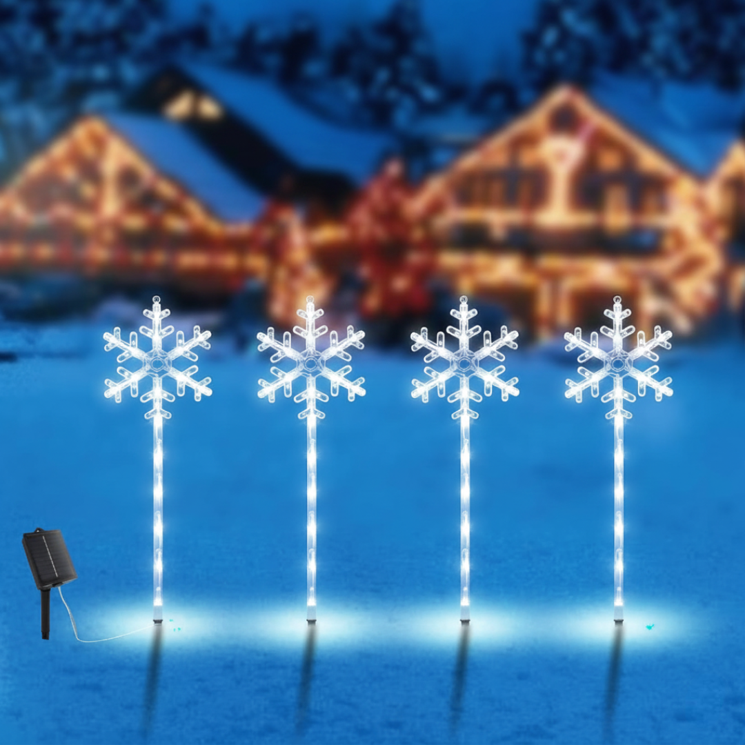 Solar snowflake pathway lights set of 4 in white LED, close-up product view on plain white background showing stake and solar panel detail