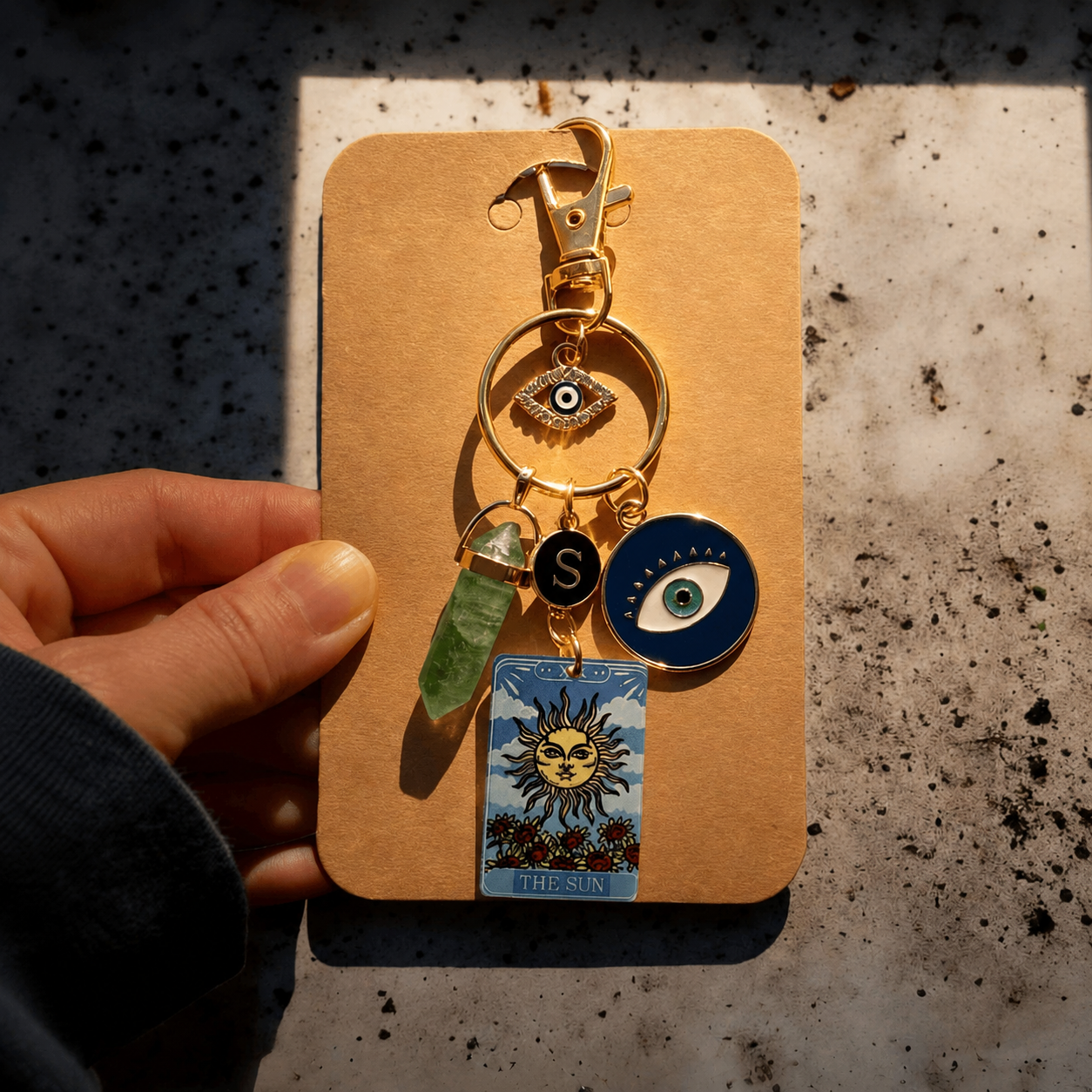 Celestial Themed Keychain With Sun Moon And Pendant Accents