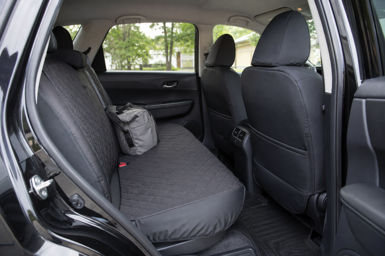 Durable fitted seat covers protecting a clean high-use passenger interior