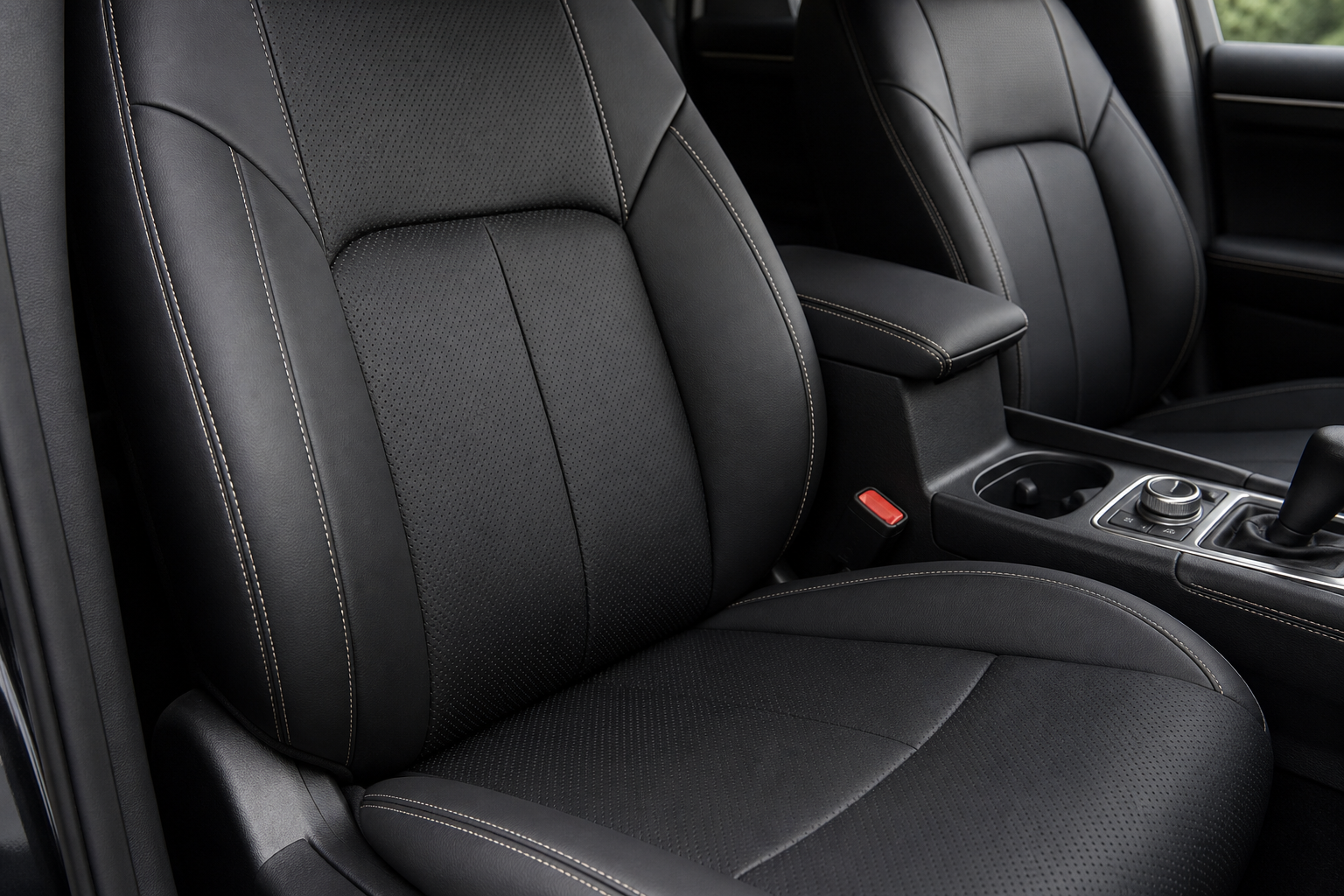 Premium leather-like seat cover showing fitted panels, stitching and texture