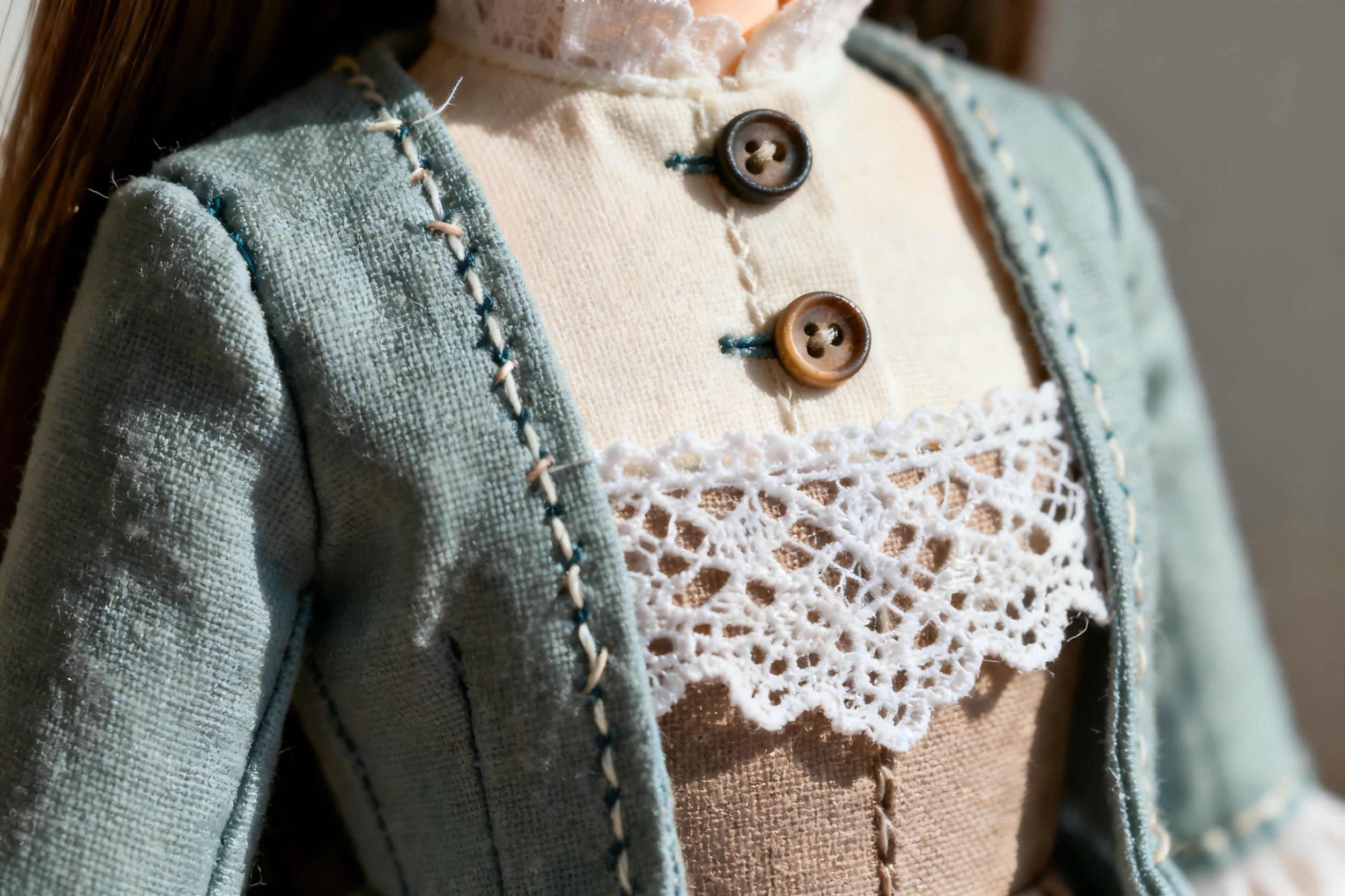 Handcrafting process of custom BJD clothing with detailed stitching