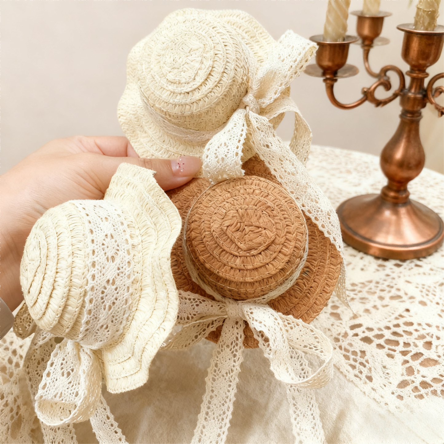 Vintage BJD straw hats with lace details by a copper candelabra - Atelier Chantilly