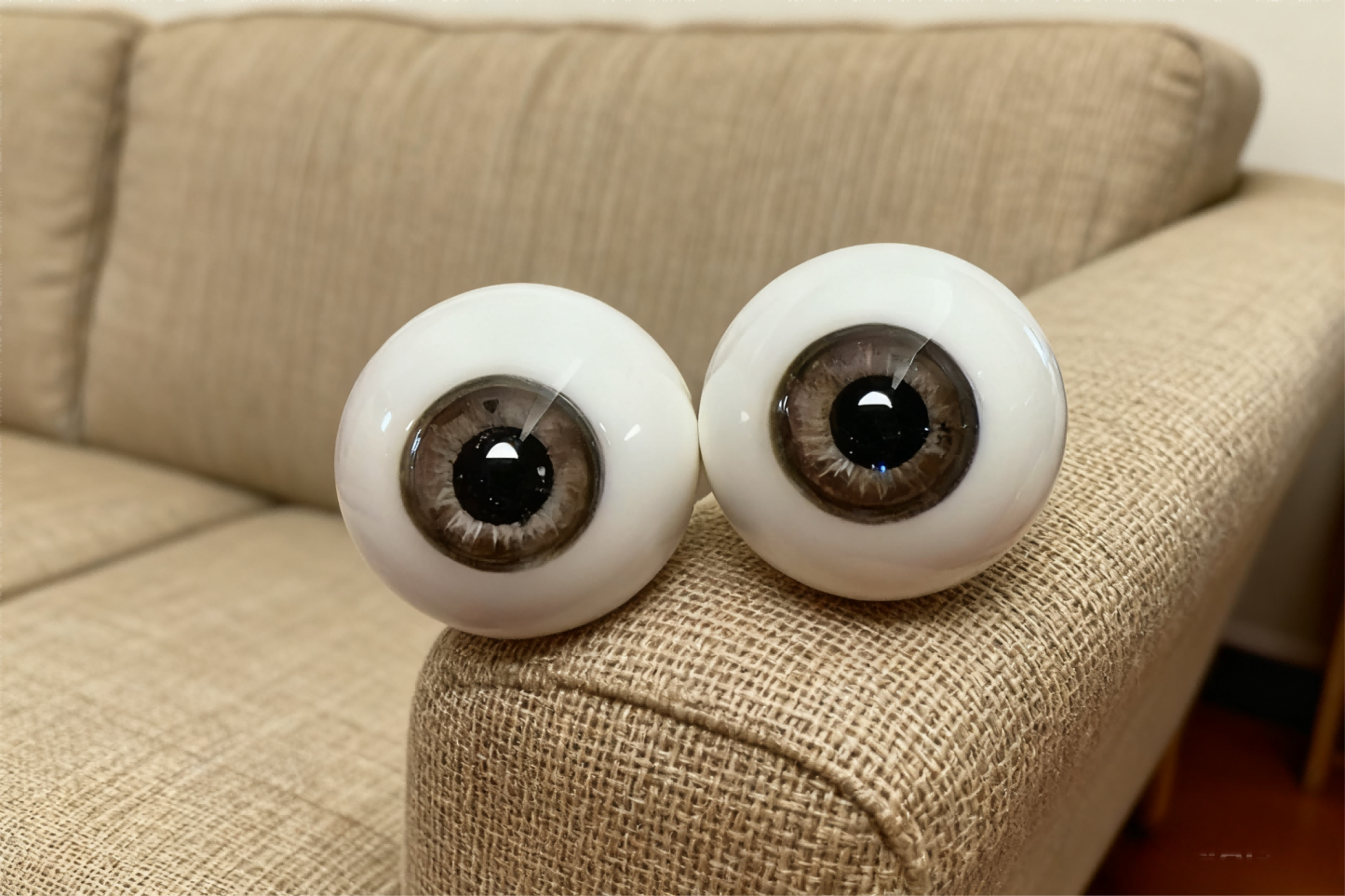 Realistic brown BJD eyes positioned on a beige sofa - Atelier Chantilly