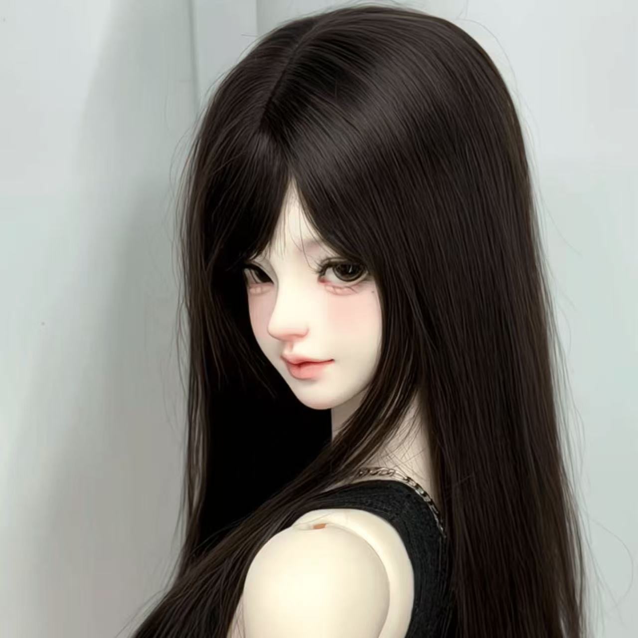 BJD doll with long black wig and classic outfit – vintage-style photography