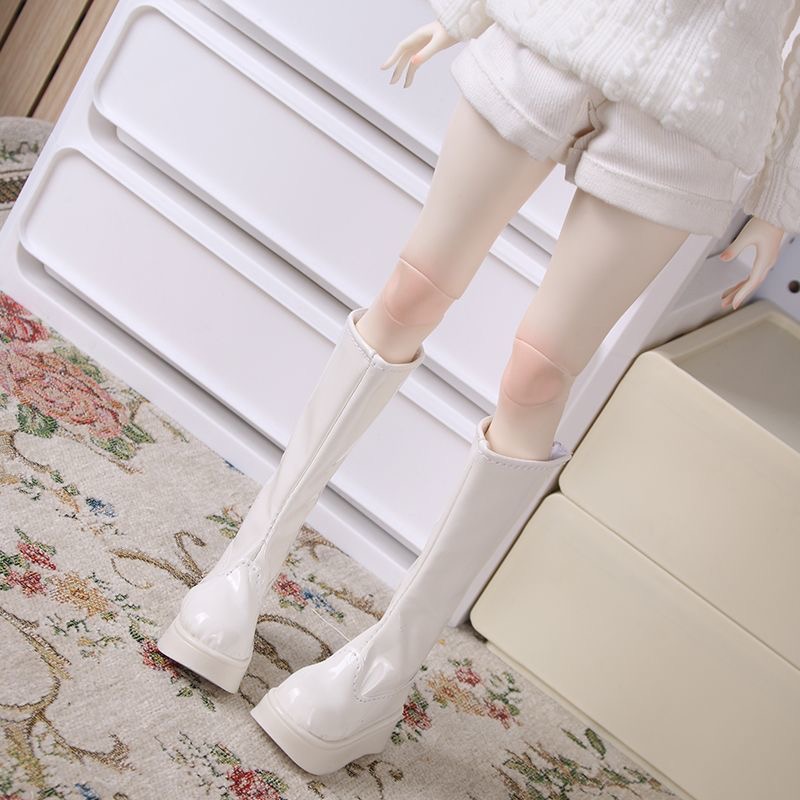 Back view of white BJD doll boots with smooth stitching