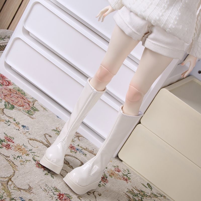 Back view of white BJD doll boots with smooth stitching