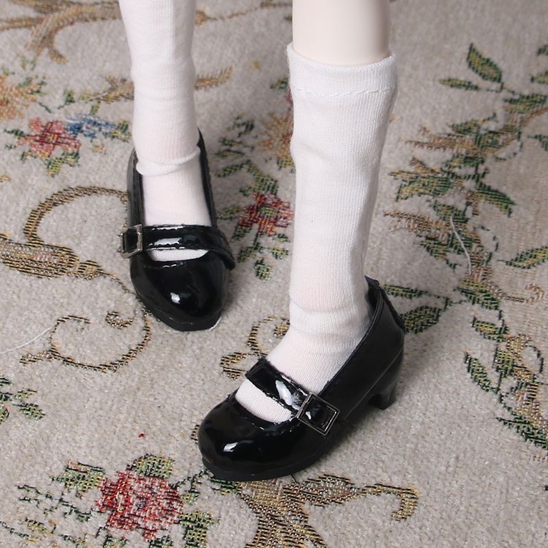 Front view of BJD black patent shoes with silver buckle and soft white socks