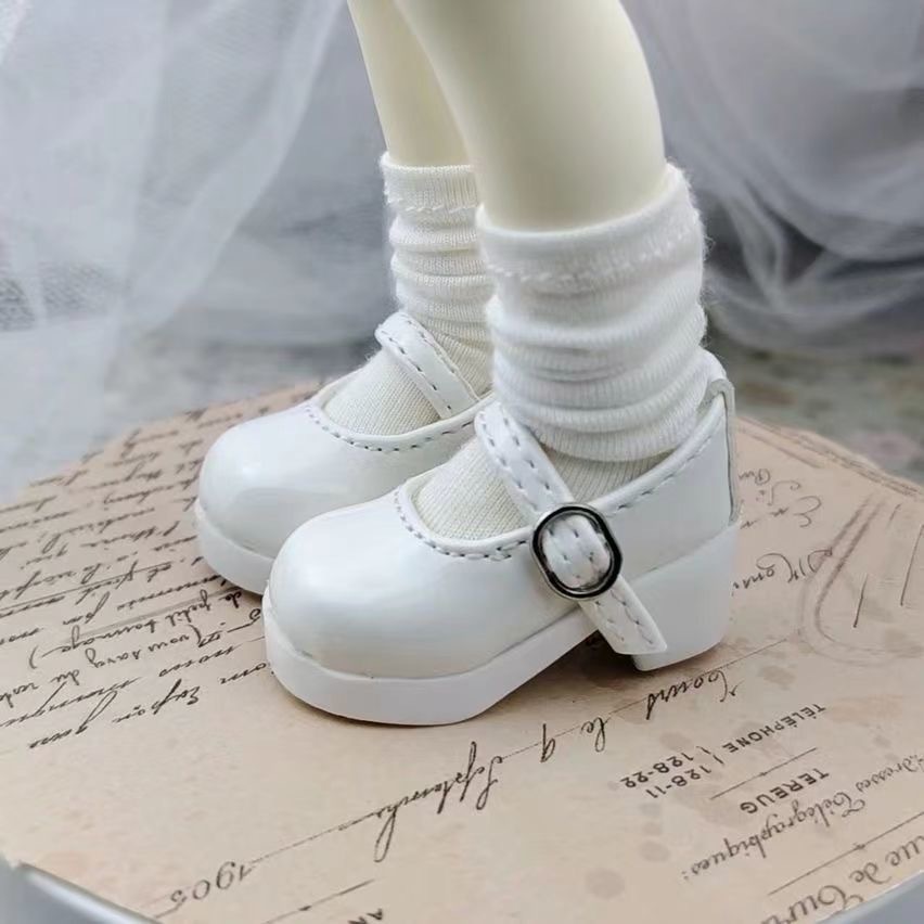 ** Matte white BJD Mary Jane shoes with bows