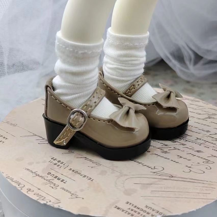 ** Black BJD doll shoes with double bow design
