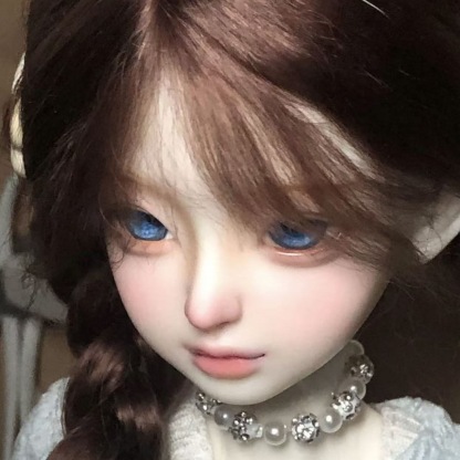 Close-up of brown braided BJD wig showing lifelike hair fiber detail