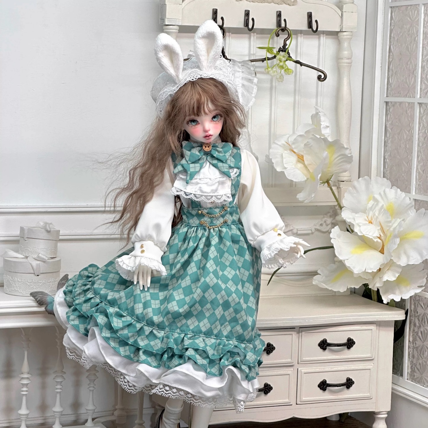 1/4 BJD doll in mint green bunny Lolita dress surrounded by floral decor - Atelier Chantilly
