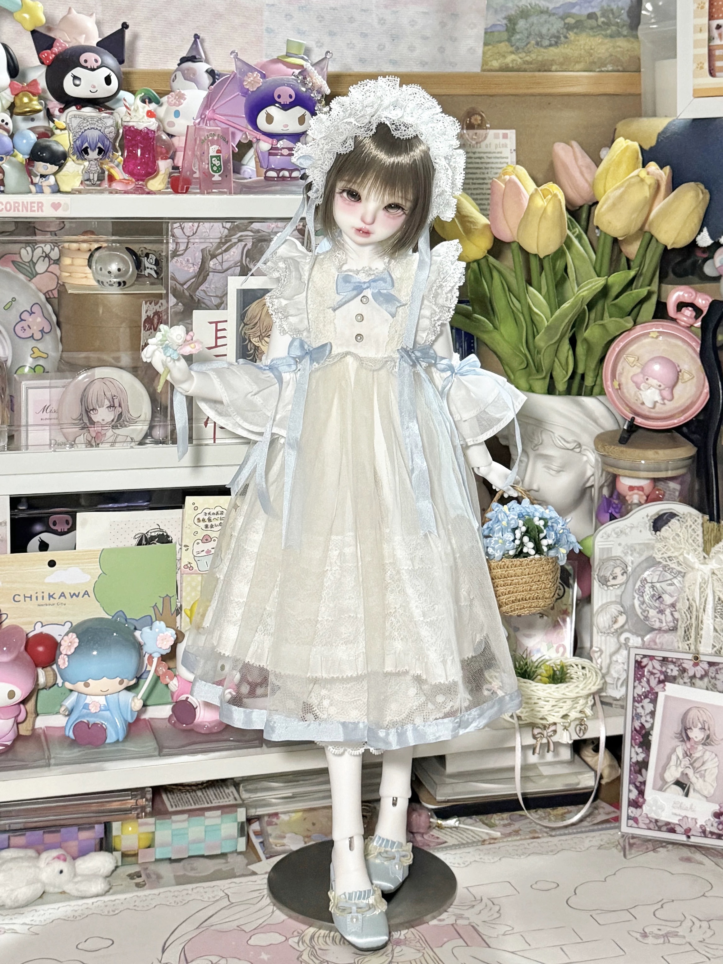 1/4 BJD doll in pastel blue Lolita outfit amidst cute collectibles - Atelier Chantilly