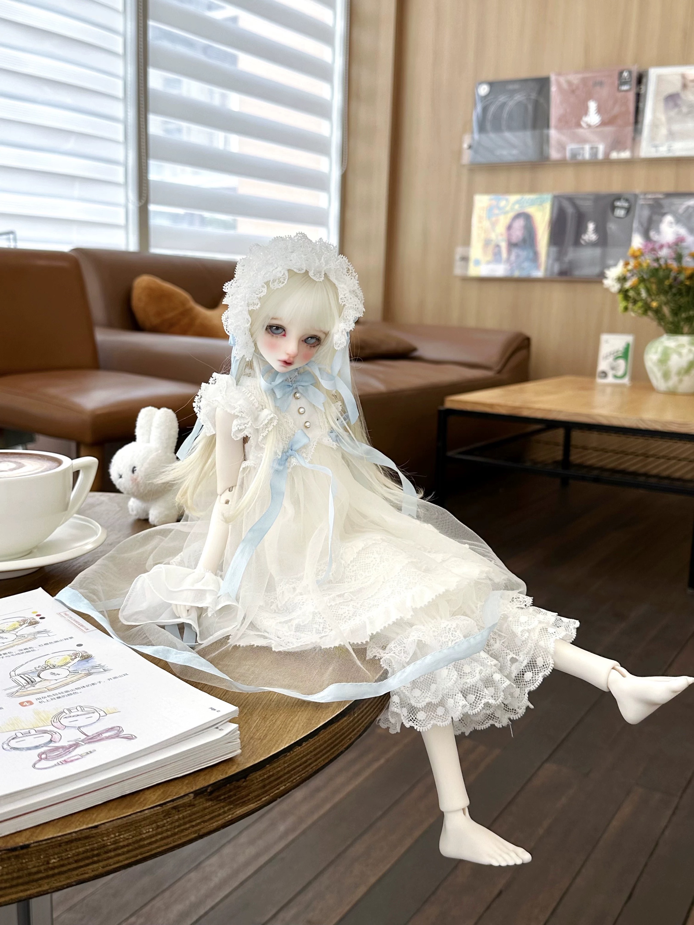 Pastel blue lace BJD outfit on a café table with coffee and bunny plush - Atelier Chantilly