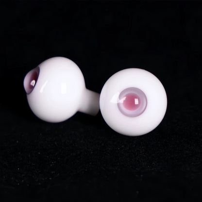 Close-up of realistic purple glass BJD eyes on a black backdrop - Atelier Chantilly
