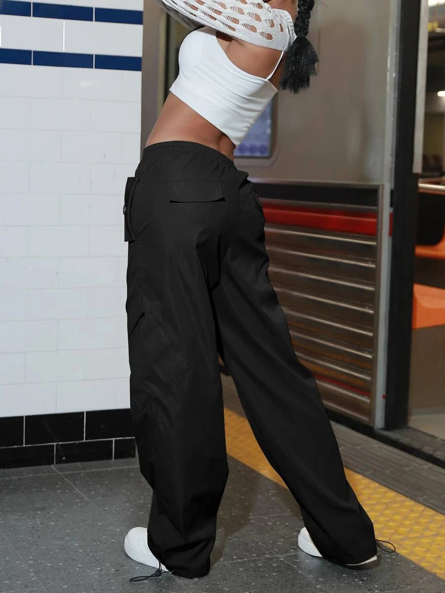 Flap Pocket Drawstring Waist Parachute Cargo Pants in Black – side profile view