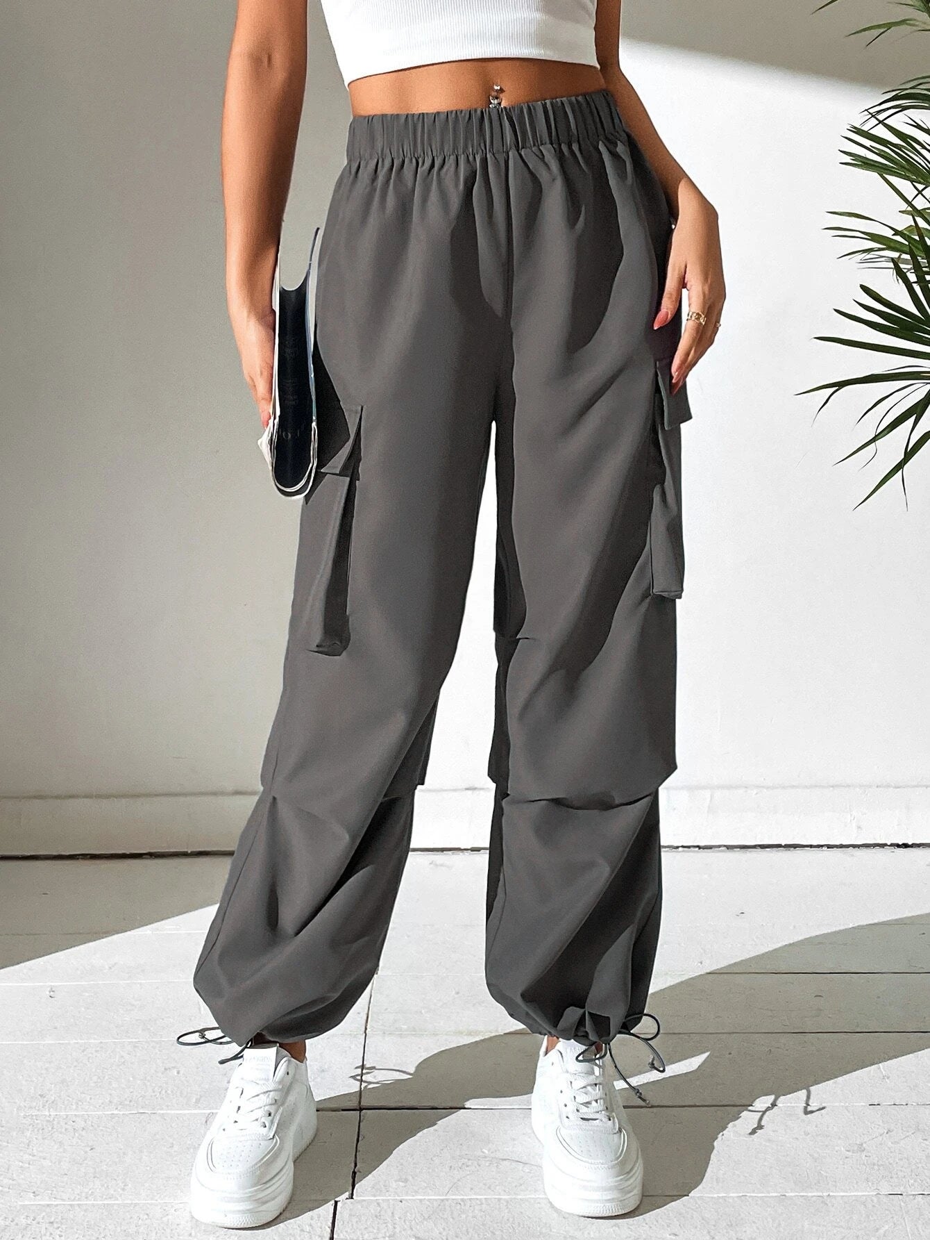 Plain Pocket Side Cargo Pants in Black – lifestyle view 11