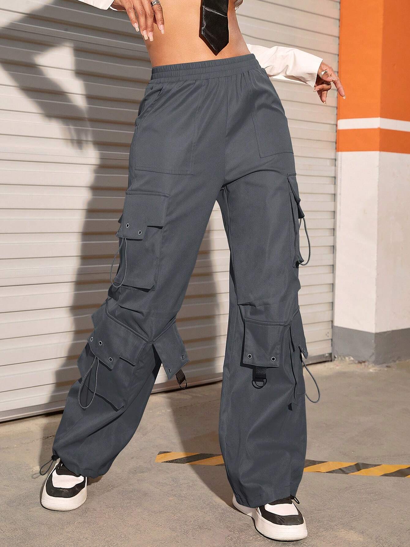 Flap Pocket Drawstring Hem Cargo Parachute Pants in Black – pocket detail close-up