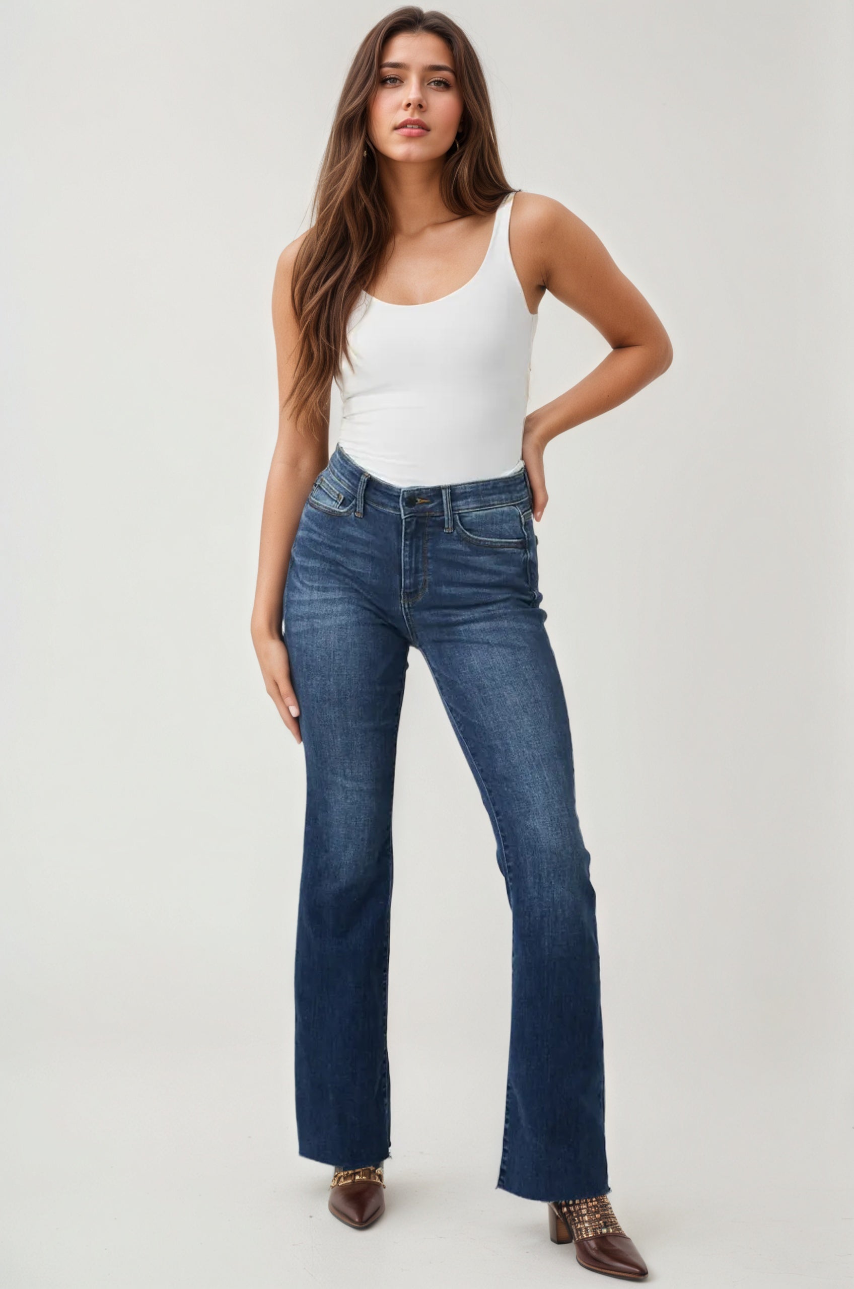 Mid Rise Tuck Bootcut Jeans – model wearing view