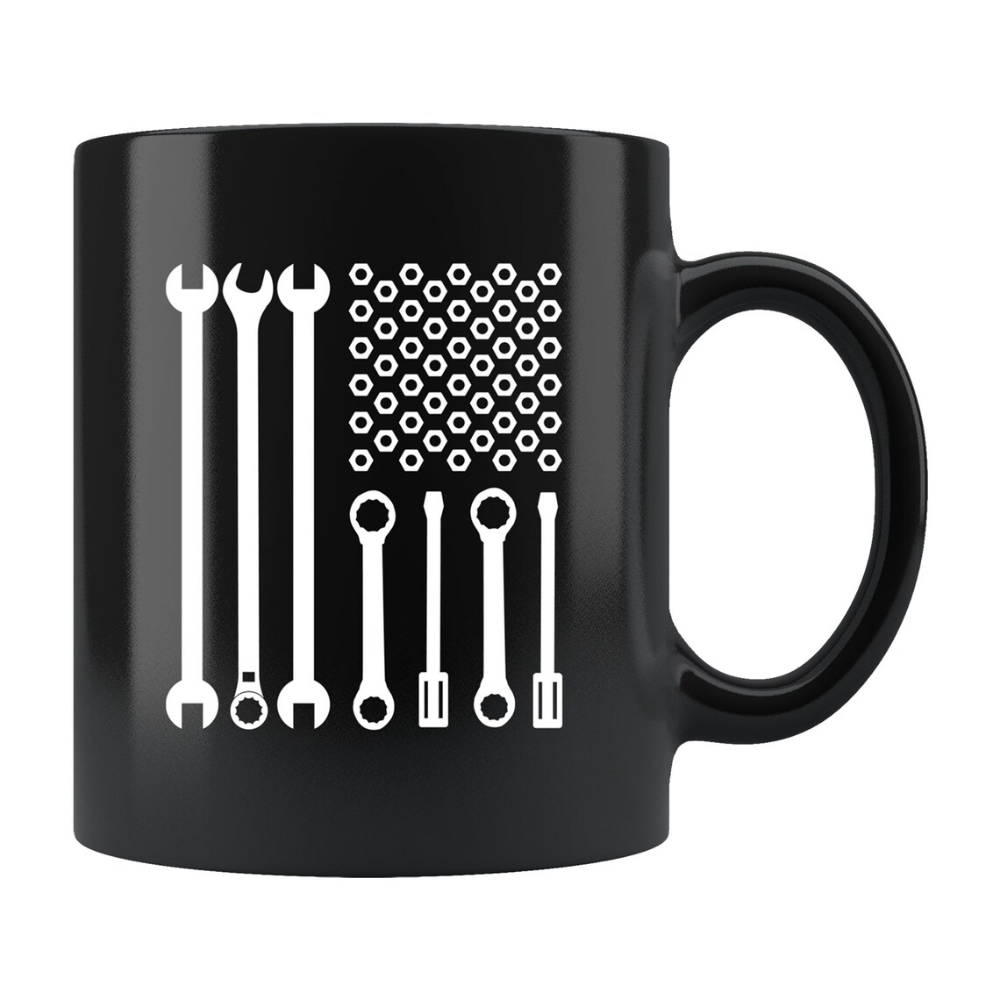 May include: Black ceramic mug featuring a white graphic design resembling the American flag, but with wrenches and nuts replacing the stars and stripes. The mug has a curved handle and a glossy finish, suitable for hot or cold beverages. Report this item