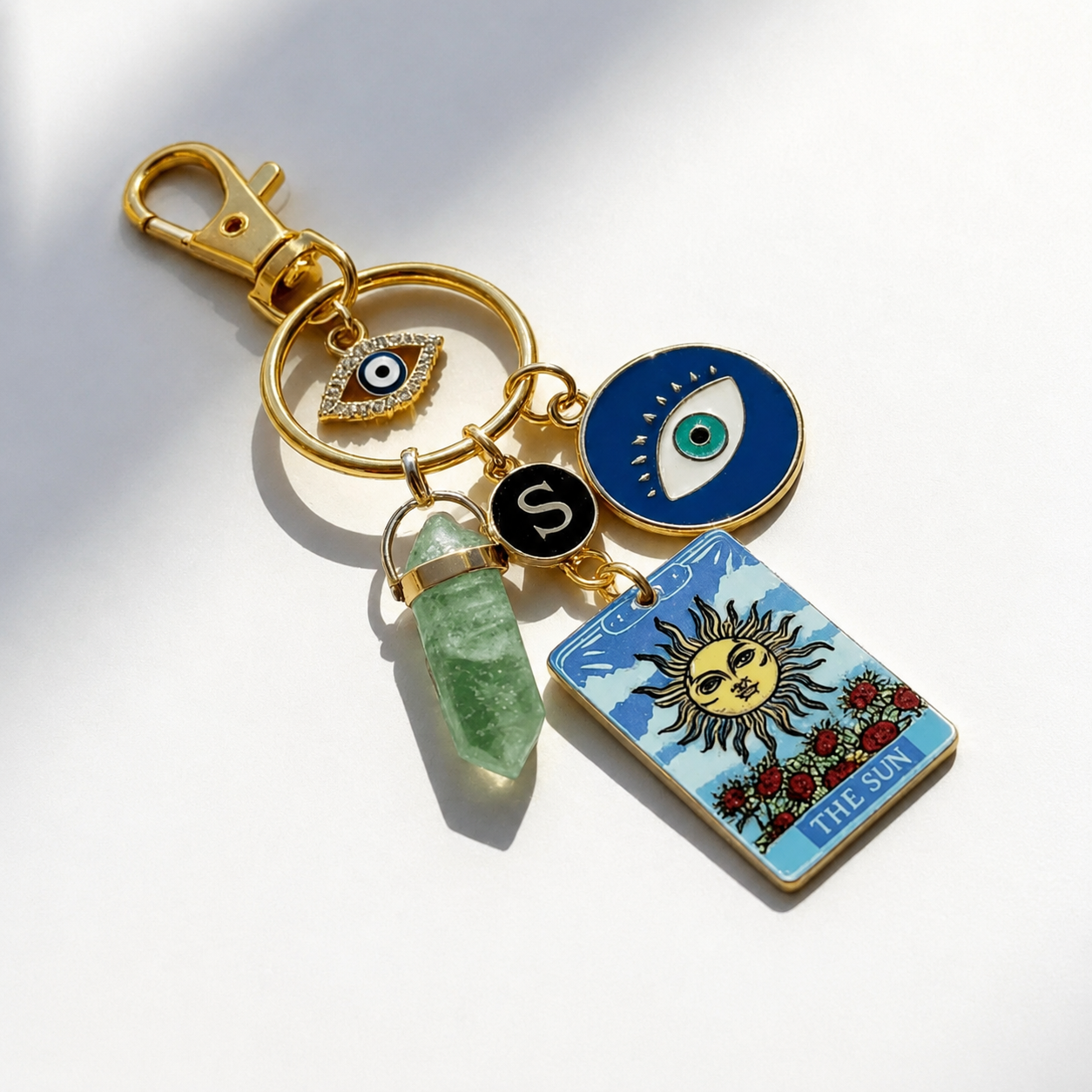 Celestial Themed Keychain With Sun Moon And Pendant Accents