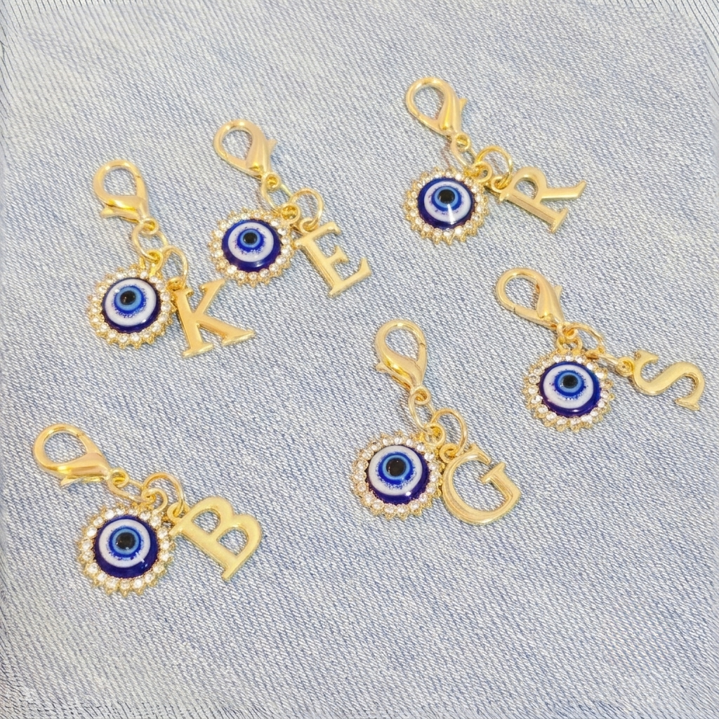 Celestial Themed Keychain With Sun Moon And Pendant Accents